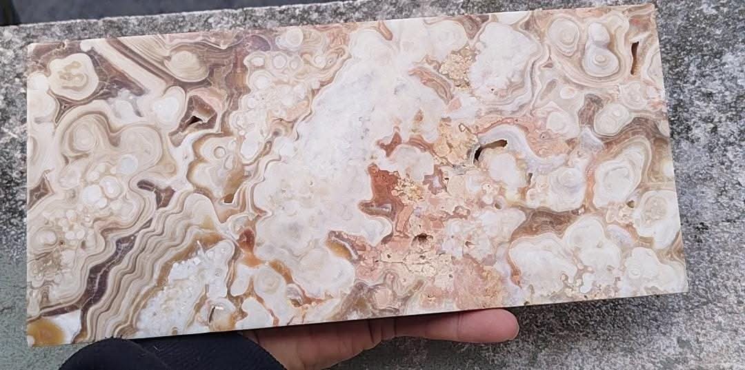 Polished chocolate calcite slab.
