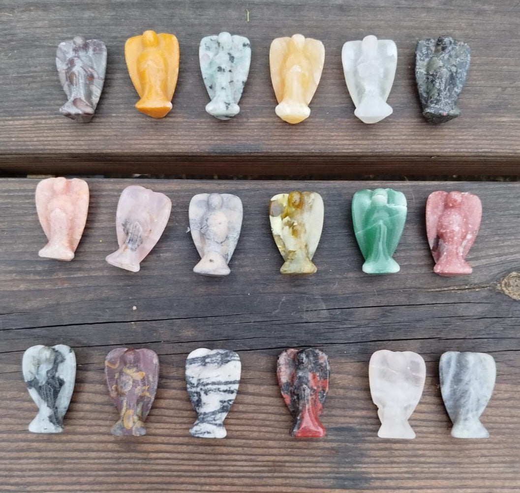 Mini angel sculptures, made from various natural stones.