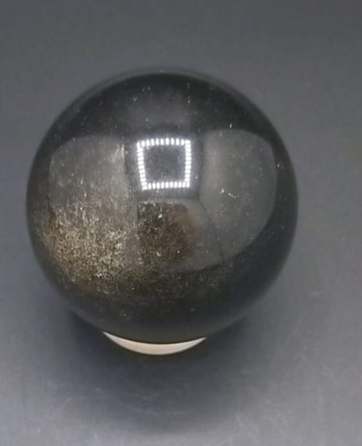 Esfera de obsidiana dorada