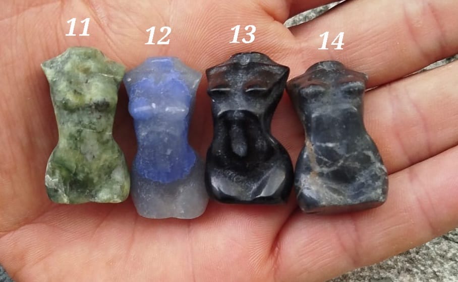 Sculptures of women's bodies in various natural stones.